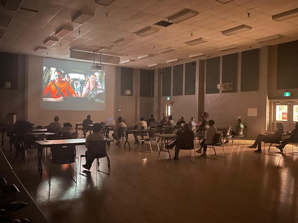 TNI patients watching a movie in the Brown Auditorium